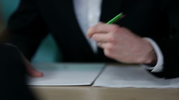 Employees at meeting writing down notes — Stock Video