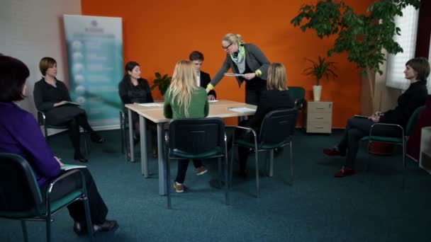 Young business employees solving sheets for meeting — Stock Video