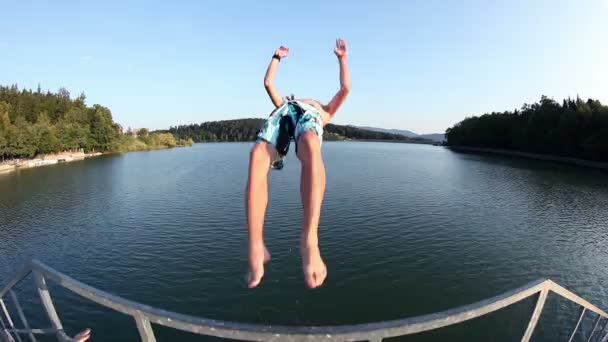 Jumping and swimming in the lake fisheye lens — Stock Video