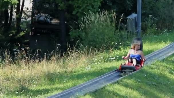 Woman driving with bobsled — Stock Video