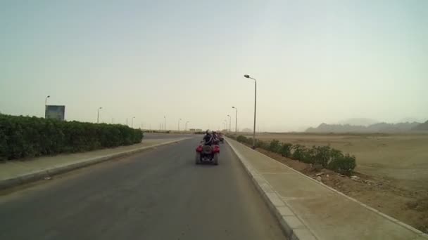 People driving on quadro motorcycles in Egypt — Stock Video