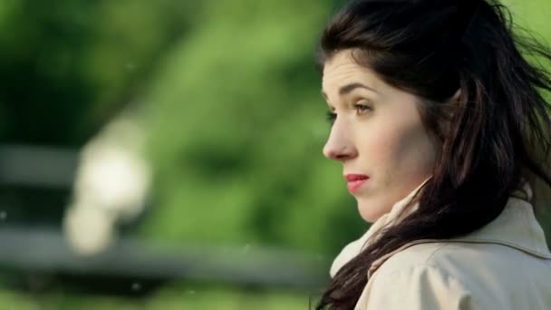 Woman in windy spring weather being happy to see someone — Stock Video