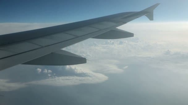 Beautiful cloudscape view from airplane with wing in front — Stock Video