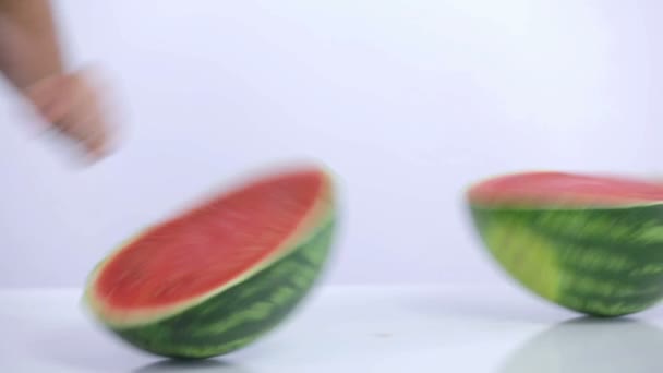 Watermelon sliced in two parts and left to swing around. — Stock Video