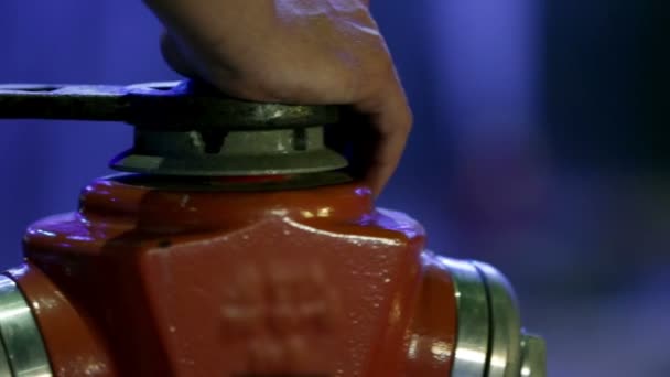 Two hydrants one of which is spurting the water in the air — Stock Video