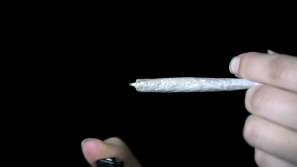 Female At Lighting Up A Joint With A Lighter In Slow Motion — Stock Video