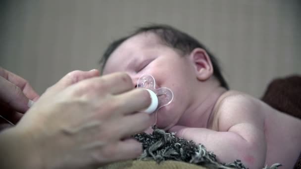 Baby right at the time when he gets a pacifier — Stock Video