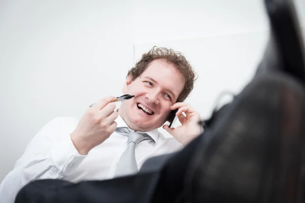 Affärsman i telefon — Stockfoto