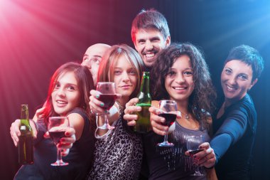 Group of beautiful young friends at the disco club clipart