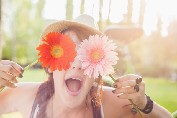 Young woman with flowers — Stock Photo, Image