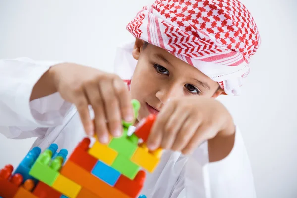 Arabic boy playing with toys — Stock Photo, Image