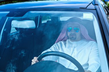 Arabian Businessman Driving Car clipart