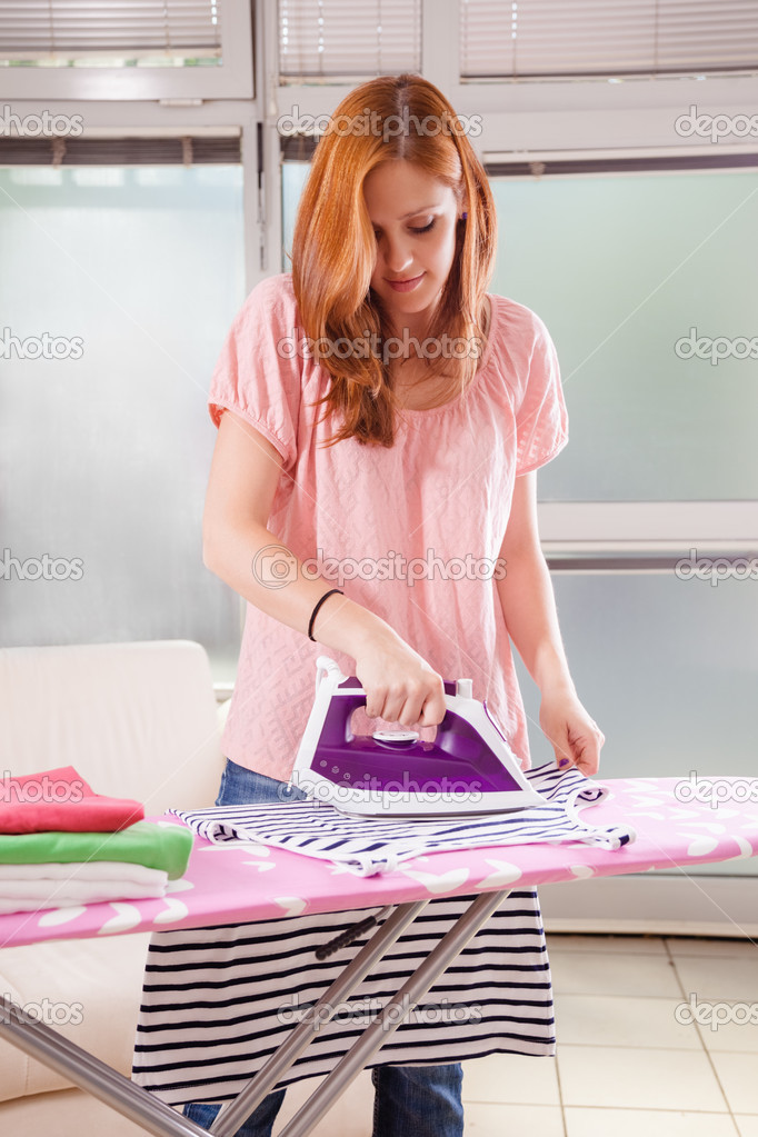 Female Ironing Clothes — Stock Photo © Dangubic 50485483