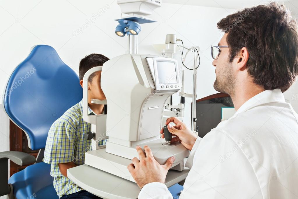 Ophthalmologist With Little Boy