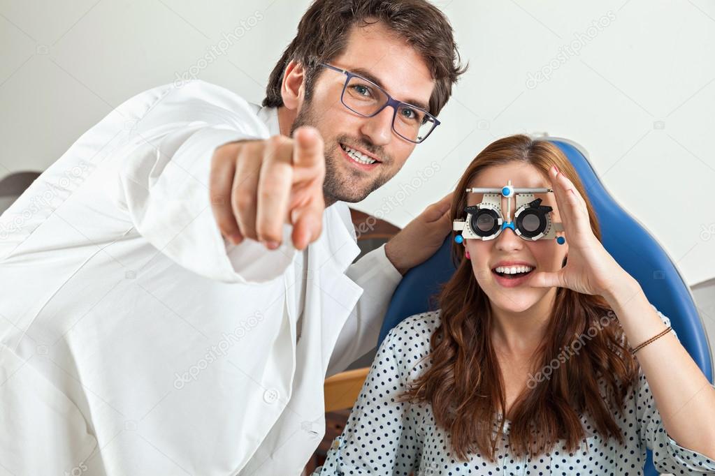 Optometrist Giving Woman Eye Examination