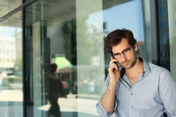 Handsome man having phone conversation — Stock Photo, Image