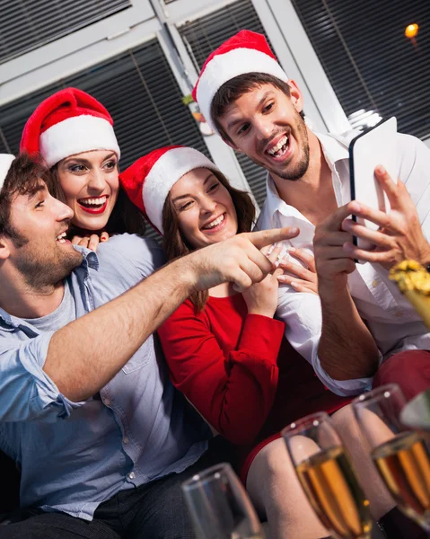 People using tablet on new year's eve — Stock Photo, Image