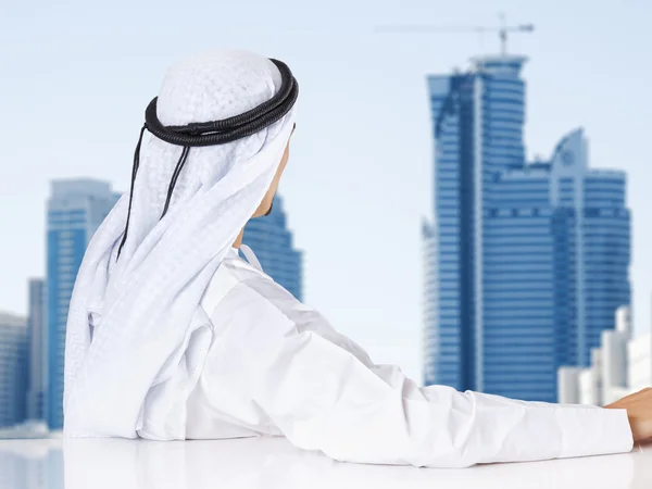 Arab businessman looking out window — Stock Photo, Image