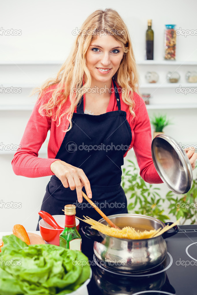 Woman preparing meal in kitchen