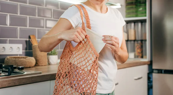 Closeup Young Woman Putting Reusable Cotton Produce Bag Shopper Mesh — стоковое фото