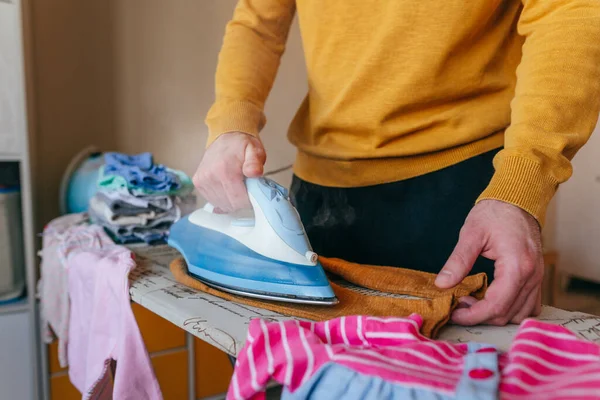 Close Young Man Ironing Baby Clothes Children Room Father Doing — Stock Fotó