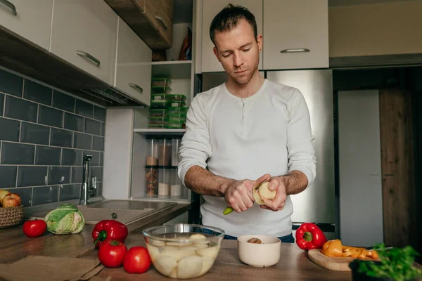 Man Peeling Potatoes Young Man Cooking Vegetables Kitchen Preparing Potato — стоковое фото