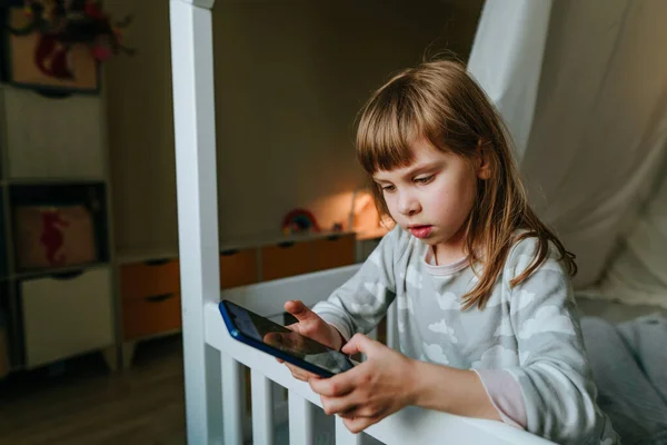 Little Girl Using Smartphone Sitting Bed Handmade House Generation Alpha —  Fotos de Stock