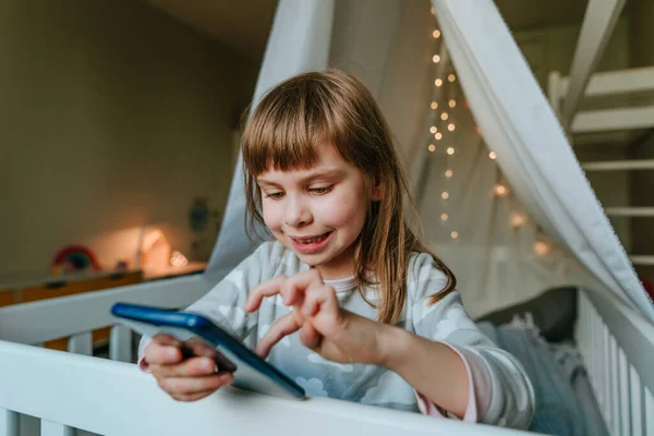 Little Girl Using Smartphone Sitting Bed Handmade House Generation Alpha —  Fotos de Stock