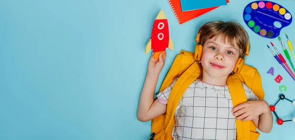 Cute Little Girl Headphones Backpack Surrounded Different School Stationery Lying — Stock Photo, Image