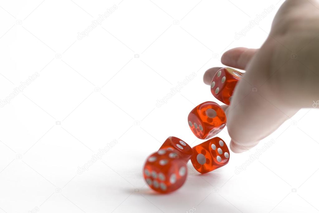 Hand with dices isolated on white