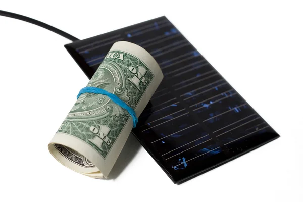 Solarmodul mit Dollars isoliert auf weiß — Stockfoto