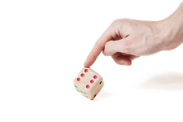 Dobbelstenen gemaakt van hout geïsoleerd op wit met vinger — Stockfoto