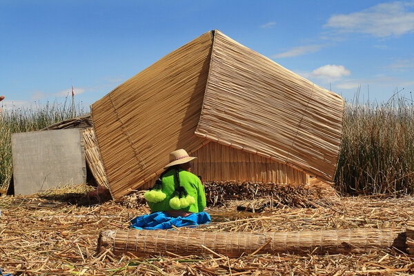 Women on floating and tourist Uros Islands of lake Titicaca, Per