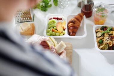 Catering diet. The cook prepares healthy diet boxes.
