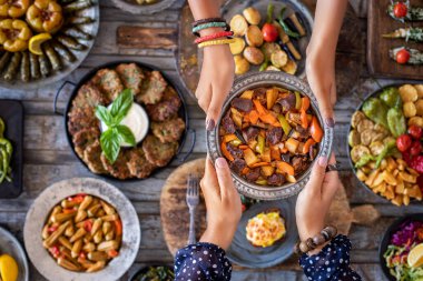 Meat stew with vegetables. Orman kebab . Cooked foods in the copper plate or pot. 
