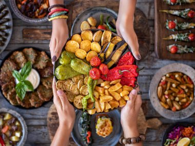 Mix vegetable fried with eggplant, tomato, potatoes, zucchini and pepper. karisik kizartma . Vegan and vegetarian food to the table. 