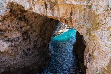 Grotta del Turco is so called, as in the ninth century the ships of the Saracens took refuge in the crevices of this strategic promontory, to attack ships in transit and plunder them. clipart