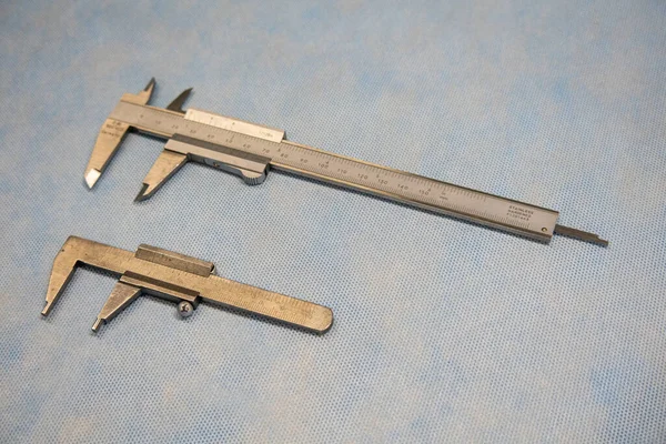 Two Calipers Different Sizes Lie Next Each Other — Stock Photo, Image