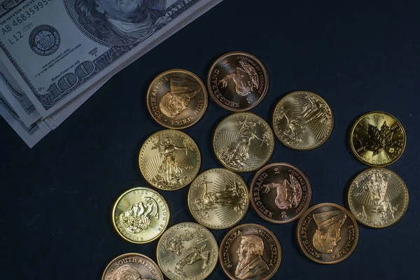 Gold Coins Lie Spread Out Next Stack Dollar Banknotes — Fotografia de Stock