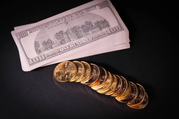 Gold Coins Lying Next Stack 100 Dollar Banknotes — Stockfoto