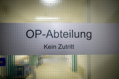 a sign on the door says no access to the operating room area