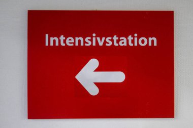 Intensive care unit and a white arrow are on the red sign clipart