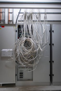 many grey power cables are laid in a new operating theater building