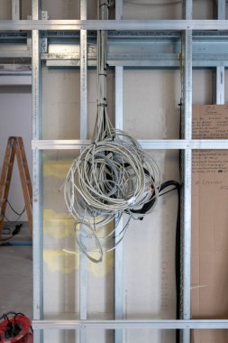 many grey power cables are laid in a new operating theater building