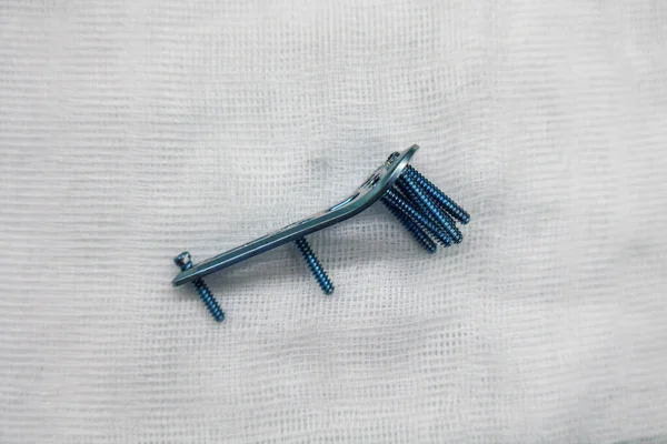 Explanted Surgical Blue Titanium Radius Plate Lies White Compress — Stock Photo, Image