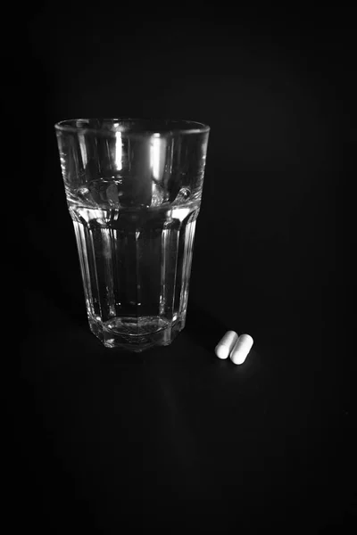 Next Glass Water Two White Pills — Zdjęcie stockowe