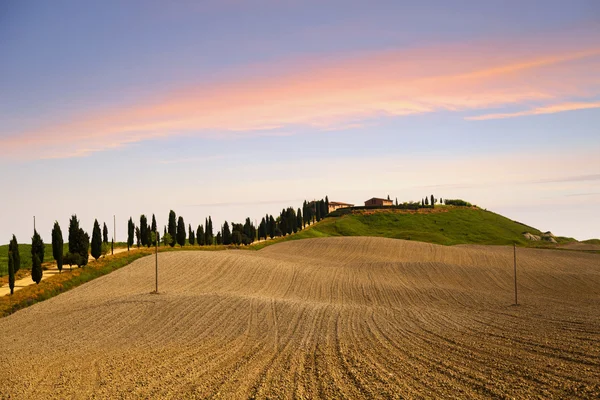 Colinas da Toscana ao pôr do sol — Fotografia de Stock