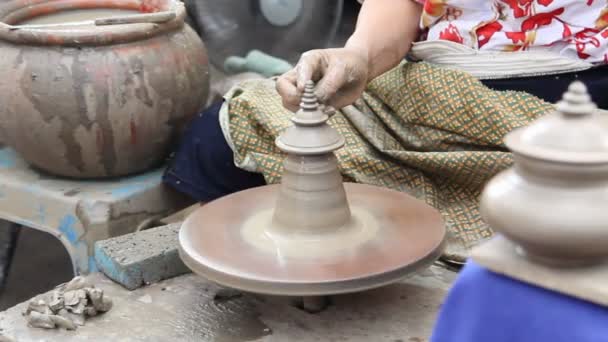 Close up of hands making earthen jar on a wheel in traditional Thailand style — Stock Video