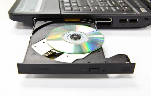 Closeup cdrom tepsi ve disket laptop — Stok fotoğraf