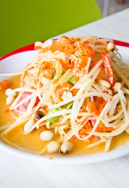 Thailändische Küche - scharfer Papayasalat lizenzfreie Stockbilder